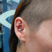 conch piercing with 13 Stone Flower Press-fit End in Gold from LeRoi