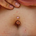 Navel piercing with Choctaw Navel Curve in Gold with Topaz from BVLA