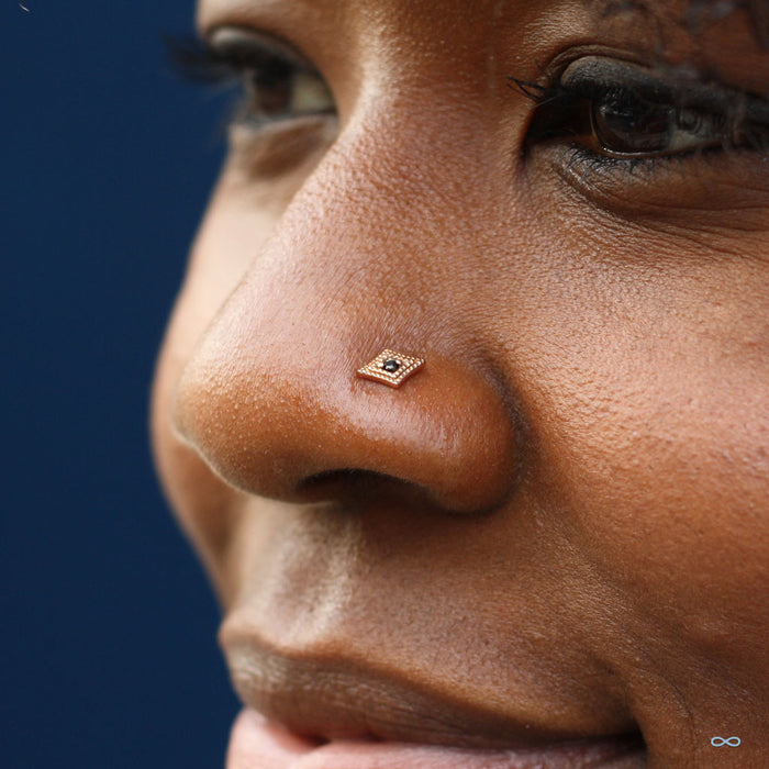 Nostril piercing with Diamond Double Millgrain Press-fit End in Gold from LeRoi with Black CZ