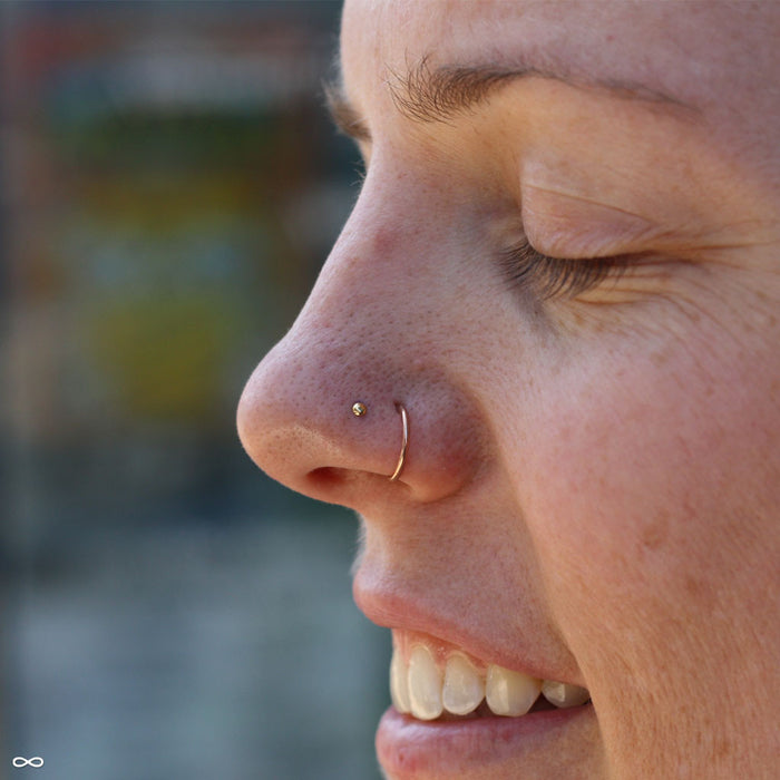 Nostril piercing with Dome Press-fit End in Gold from LeRoi in 2mm 14k Yellow Gold